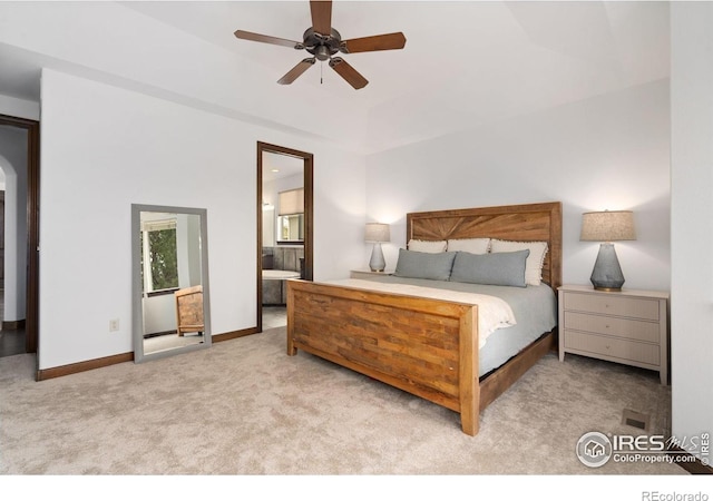7225 Royal Country Down Dr, Windsor, CO 80550 - carpeted bedroom with arched walkways, connected bathroom, baseboards, and ceiling fan