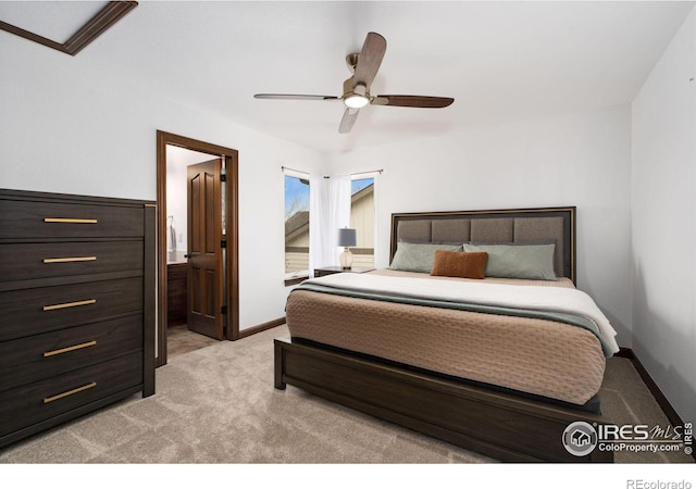 7225 Royal Country Down Dr, Windsor, CO 80550 - bedroom featuring light carpet, baseboards, a ceiling fan, and ensuite bath