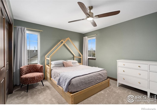 7225 Royal Country Down Dr, Windsor, CO 80550 - bedroom with light carpet, a ceiling fan, and baseboards