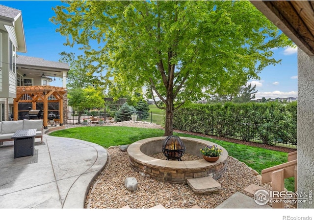 7225 Royal Country Down Dr, Windsor, CO 80550 - view of yard with a patio area, ceiling fan, and an outdoor living space with a fire pit