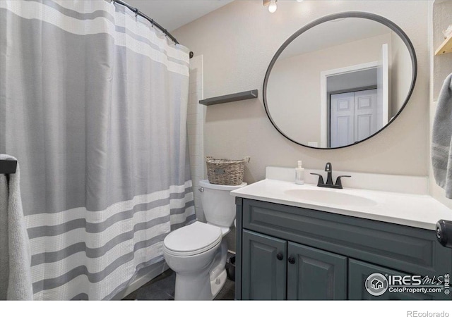 2660 E Otero Pl Unit 7, Centennial, CO 80122 - full bath featuring vanity, toilet, tile patterned floors, and a shower with shower curtain