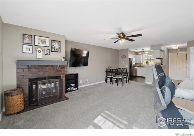 2660 E Otero Pl Unit 7, Centennial, CO 80122 - living area featuring carpet, a ceiling fan, baseboards, and a brick fireplace