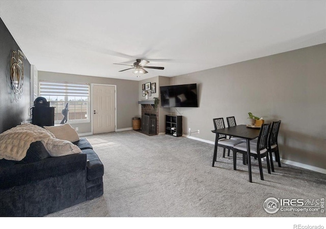 2660 E Otero Pl Unit 7, Centennial, CO 80122 - carpeted living room featuring a ceiling fan and baseboards