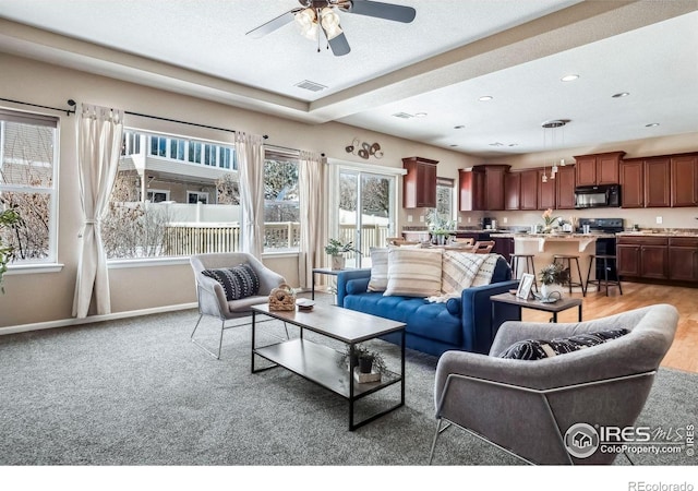 5036 Ridgewood Dr, Johnstown, CO 80534 - living room featuring ceiling fan, visible vents, recessed lighting, light carpet, and baseboards