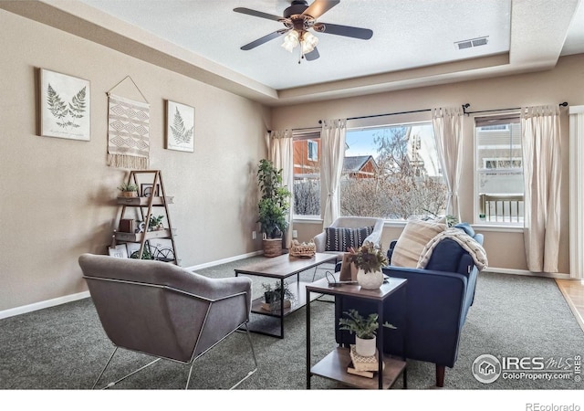 5036 Ridgewood Dr, Johnstown, CO 80534 - living area with carpet flooring, visible vents, baseboards, and a ceiling fan