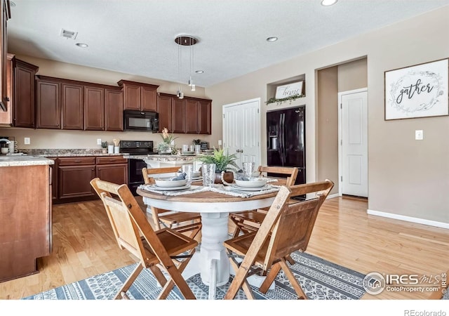 5036 Ridgewood Dr, Johnstown, CO 80534 - dining space with light wood-style floors, baseboards, visible vents, and recessed lighting