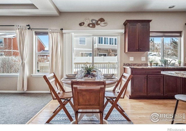 5036 Ridgewood Dr, Johnstown, CO 80534 - dining area featuring light wood-style floors and baseboards
