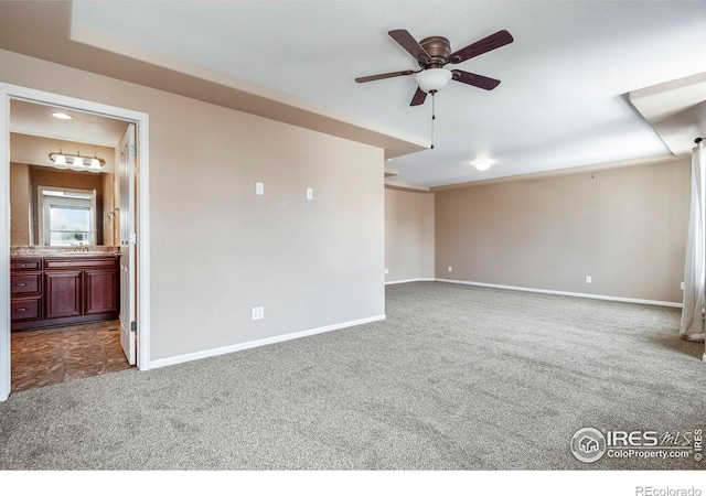 5036 Ridgewood Dr, Johnstown, CO 80534 - empty room with baseboards, dark carpet, and a ceiling fan