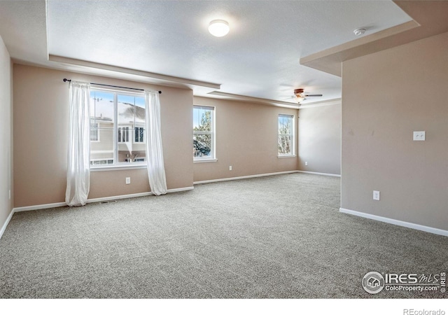5036 Ridgewood Dr, Johnstown, CO 80534 - carpeted spare room featuring visible vents, baseboards, and a ceiling fan