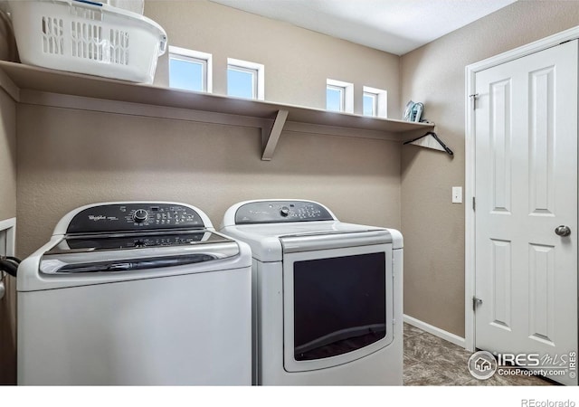 5036 Ridgewood Dr, Johnstown, CO 80534 - laundry area with laundry area, separate washer and dryer, and baseboards