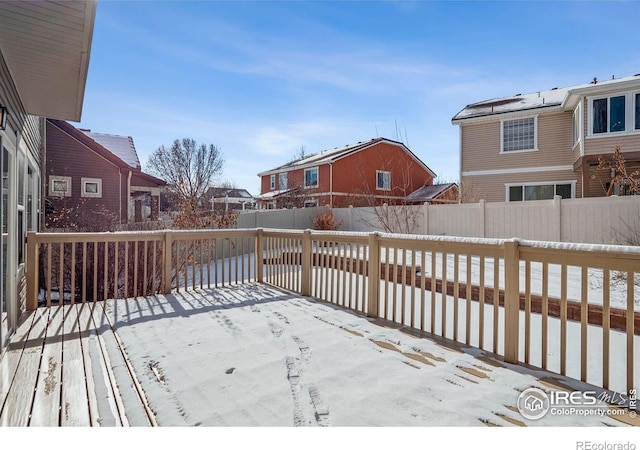 5036 Ridgewood Dr, Johnstown, CO 80534 - snow covered deck with a fenced backyard and a residential view