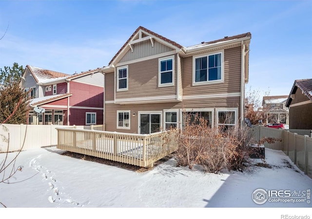 5036 Ridgewood Dr, Johnstown, CO 80534 - snow covered property with a fenced backyard and a wooden deck