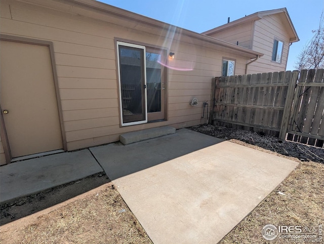 view of patio featuring fence