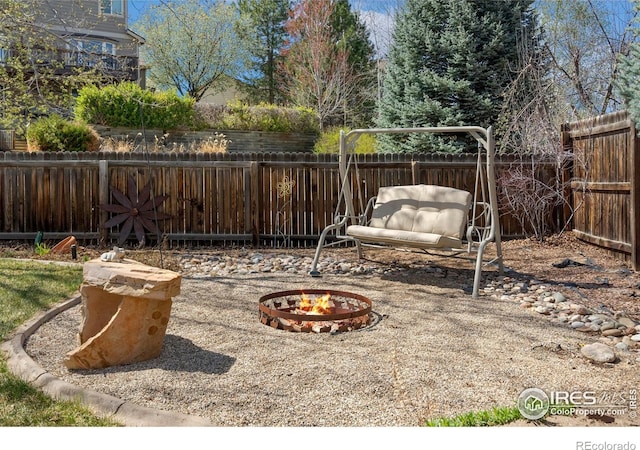 461 Scenic Dr, Loveland, CO 80537 - view of yard featuring a fenced backyard and an outdoor fire pit