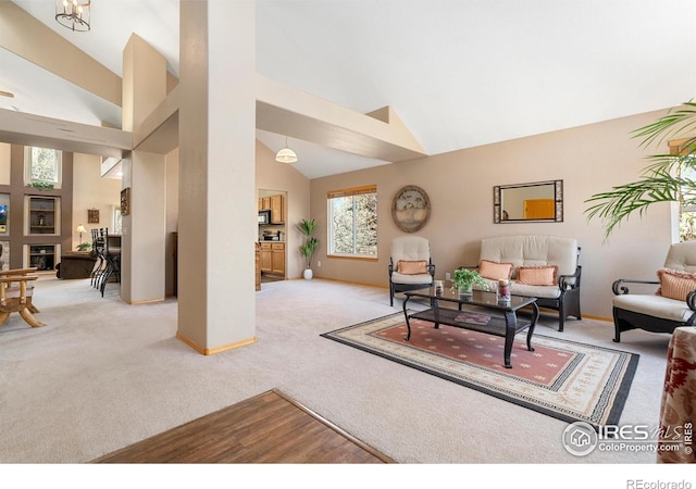 461 Scenic Dr, Loveland, CO 80537 - carpeted living area featuring high vaulted ceiling and baseboards