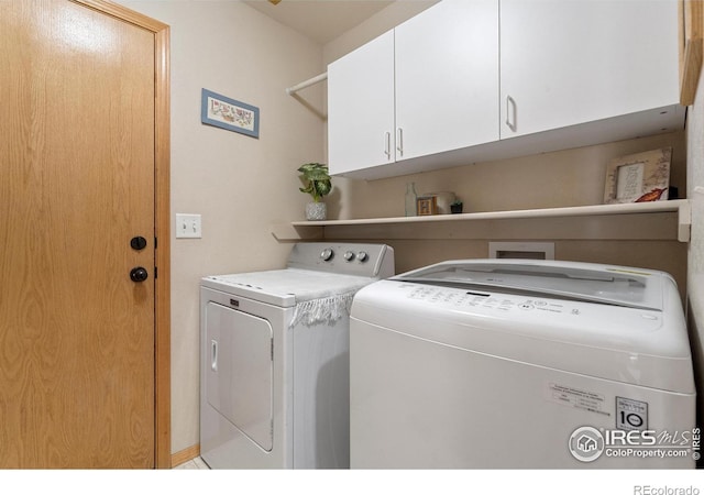 461 Scenic Dr, Loveland, CO 80537 - clothes washing area featuring washing machine and dryer and cabinet space
