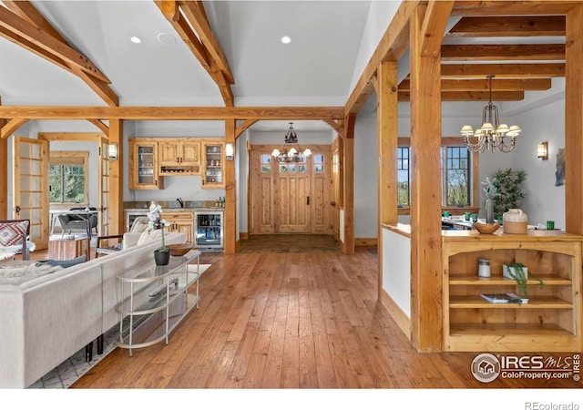 1420 Sierra Dr, Boulder, CO 80302 - entrance foyer with an inviting chandelier, beamed ceiling, light wood-style flooring, recessed lighting, and beverage cooler