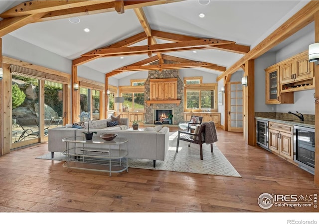 1420 Sierra Dr, Boulder, CO 80302 - living room with wine cooler, wood-type flooring, bar, and lofted ceiling with beams