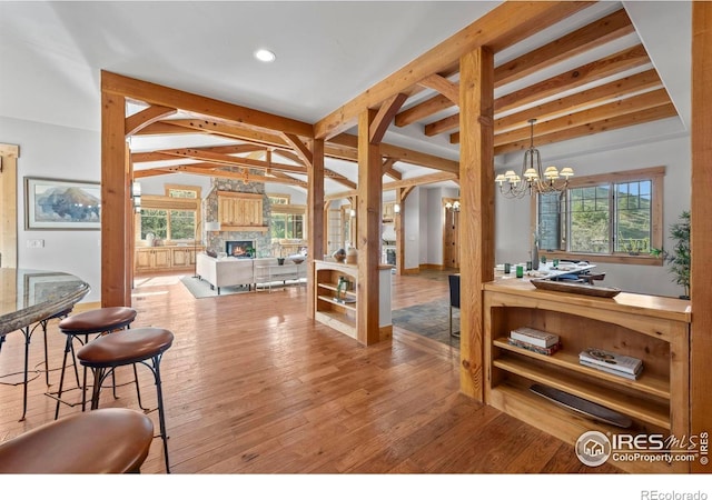 1420 Sierra Dr, Boulder, CO 80302 - dining space featuring beamed ceiling, a wealth of natural light, and a fireplace