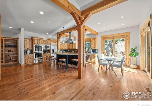 1420 Sierra Dr, Boulder, CO 80302 - dining space featuring light wood-type flooring, vaulted ceiling with beams, and recessed lighting