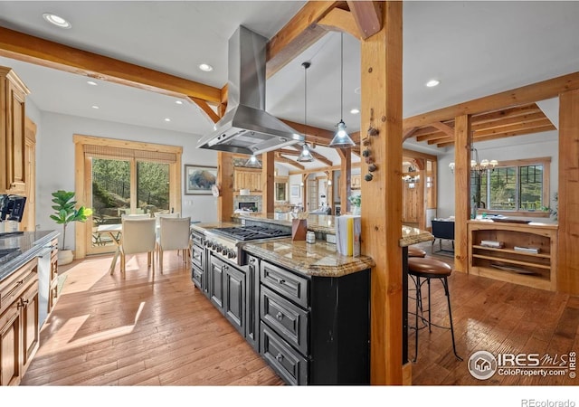 1420 Sierra Dr, Boulder, CO 80302 - kitchen with island range hood, light wood finished floors, stainless steel gas stovetop, and beamed ceiling