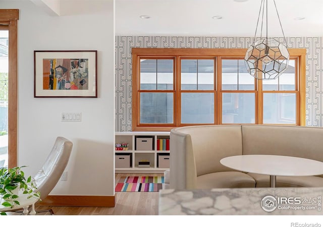 interior space featuring baseboards and wood finished floors