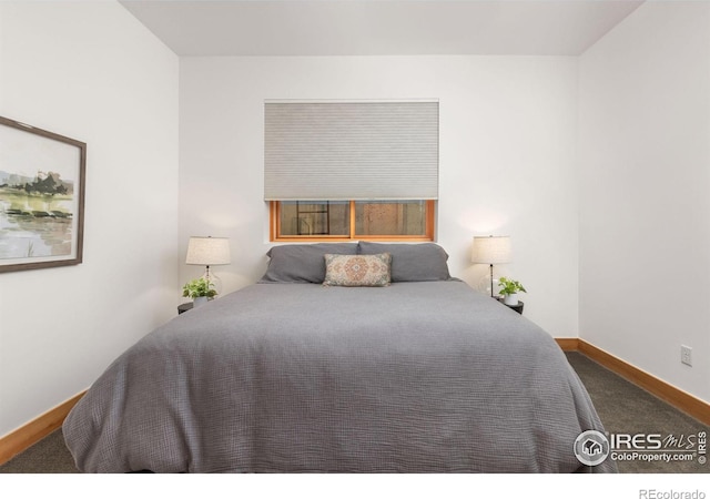 bedroom featuring baseboards and carpet floors