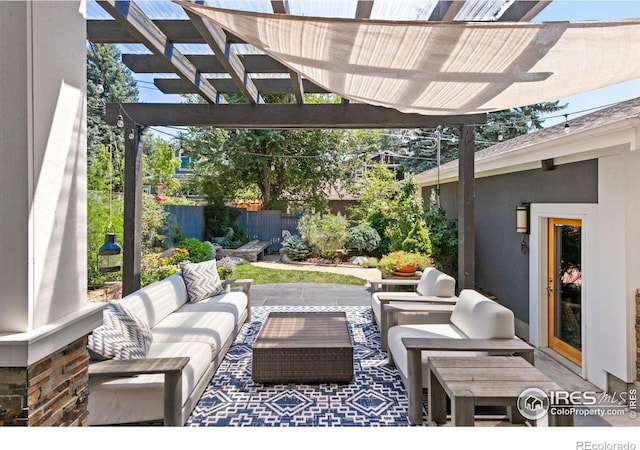 view of patio with fence, an outdoor living space, and a pergola