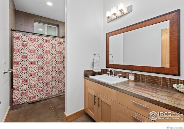 full bath with vanity, baseboards, curtained shower, and tasteful backsplash