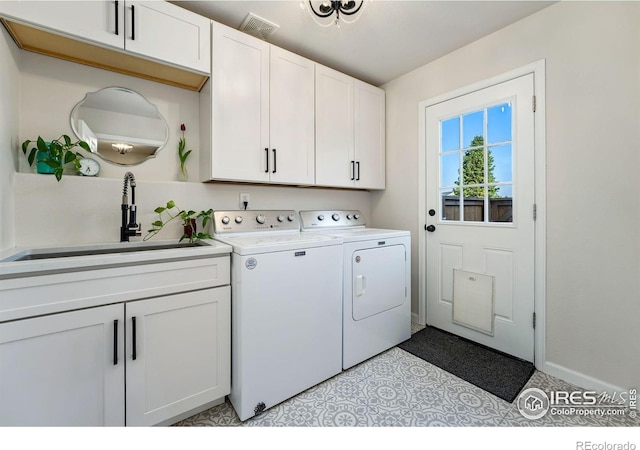 4939 Yoke Ct, Loveland, CO 80537 - laundry room featuring cabinet space, washer and dryer, and baseboards