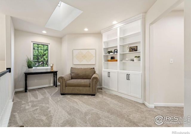 4939 Yoke Ct, Loveland, CO 80537 - living area with light colored carpet, a skylight, recessed lighting, and baseboards