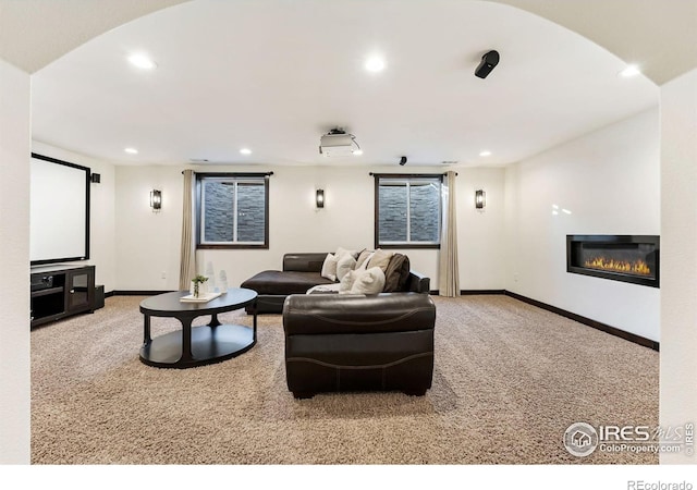 4939 Yoke Ct, Loveland, CO 80537 - cinema with carpet floors, recessed lighting, a glass covered fireplace, and baseboards