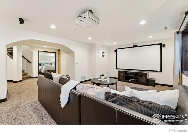4939 Yoke Ct, Loveland, CO 80537 - carpeted home theater room with baseboards, arched walkways, and recessed lighting