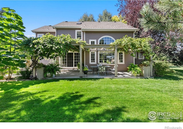 4939 Yoke Ct, Loveland, CO 80537 - back of property featuring a patio, a lawn, and a pergola