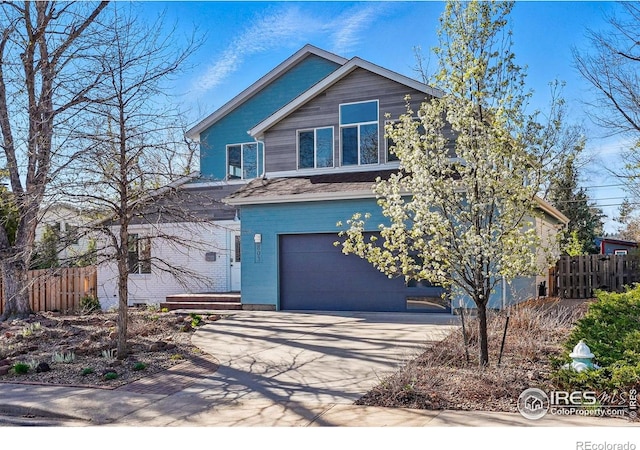 803 Ithaca Dr, Boulder, CO 80305 - view of front of house with an attached garage, fence, and driveway