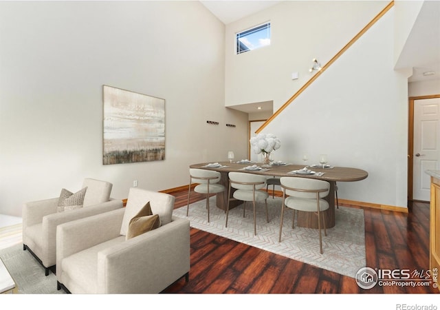 4603 Chokecherry Trl Unit 5, Fort Collins, CO 80526 - dining space featuring wood finished floors and a high ceiling