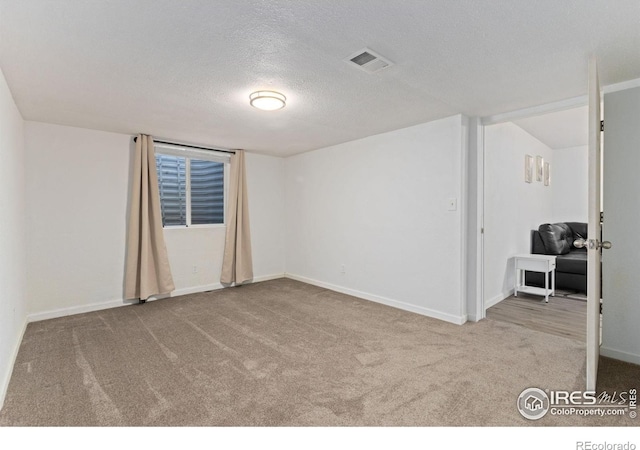 4603 Chokecherry Trl Unit 5, Fort Collins, CO 80526 - carpeted spare room featuring a textured ceiling and baseboards