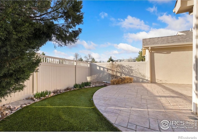 4603 Chokecherry Trl Unit 5, Fort Collins, CO 80526 - fenced backyard featuring a patio area