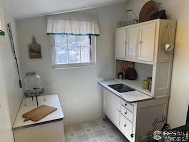 bathroom with tile patterned floors
