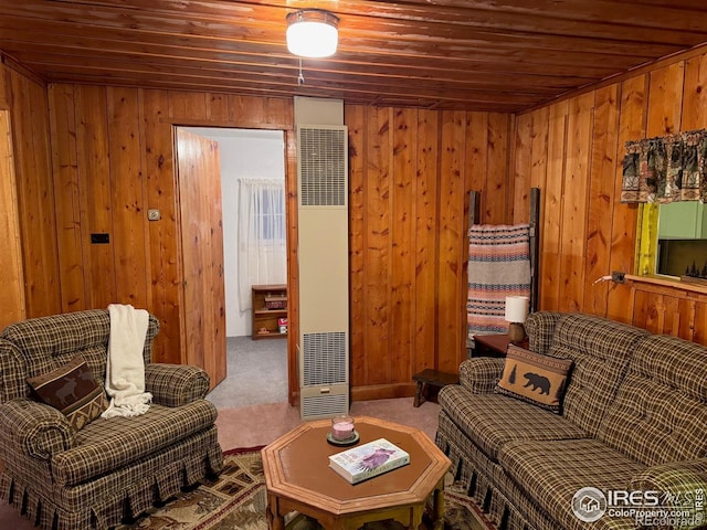 living room with wood ceiling, wood walls, a heating unit, and carpet floors
