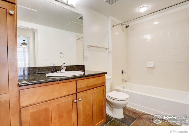 full bath featuring vanity, visible vents, shower / bathing tub combination, and toilet