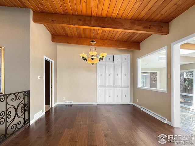 unfurnished dining area featuring visible vents, dark wood-style floors, a notable chandelier, and a baseboard radiator