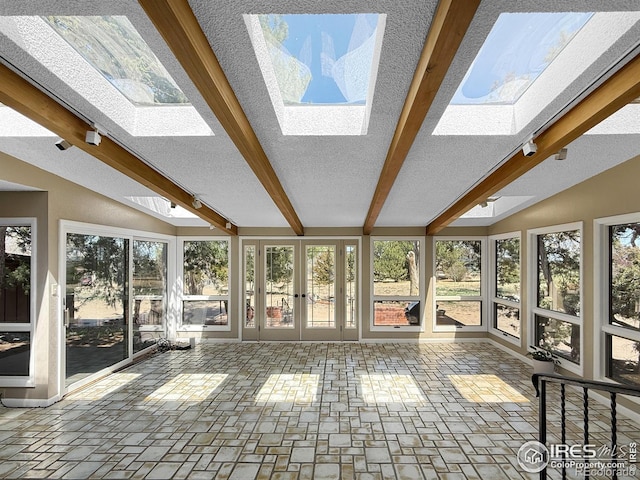 unfurnished sunroom with french doors and lofted ceiling with skylight