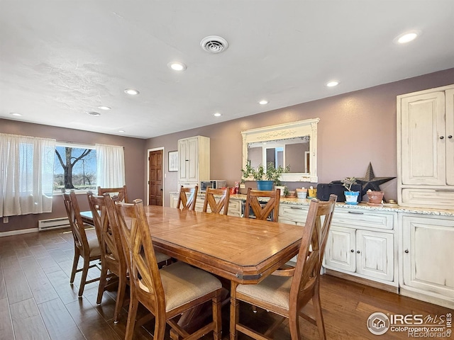 dining area featuring a baseboard heating unit, visible vents, recessed lighting, and dark wood-style flooring