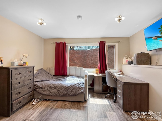 bedroom featuring wood finished floors