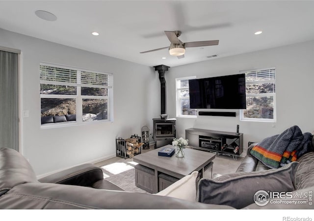 609 Hummer Dr, Nederland, CO 80466 - living area with a wood stove, visible vents, ceiling fan, and recessed lighting
