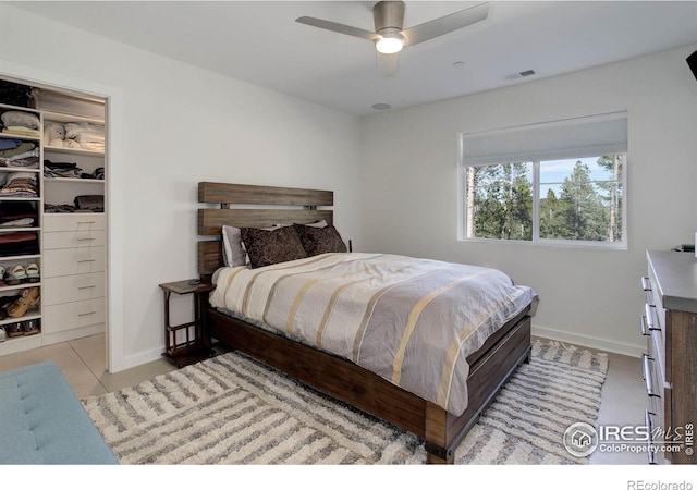 609 Hummer Dr, Nederland, CO 80466 - bedroom featuring light tile patterned floors, a closet, a spacious closet, visible vents, and baseboards