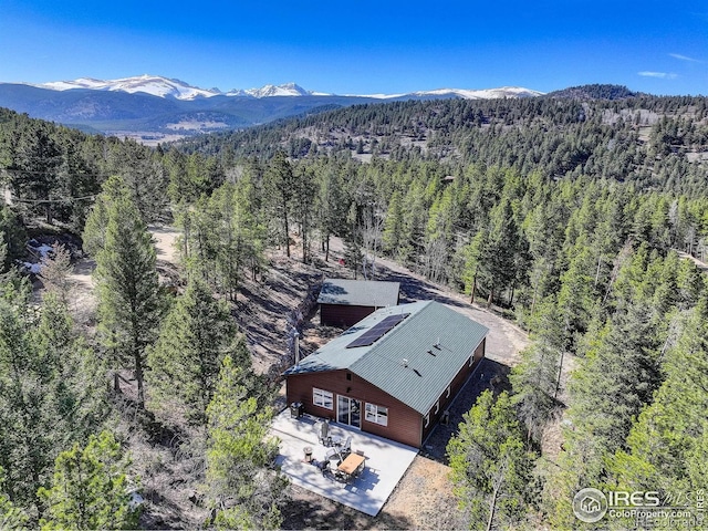 609 Hummer Dr, Nederland, CO 80466 - birds eye view of property featuring a wooded view and a mountain view
