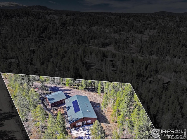 609 Hummer Dr, Nederland, CO 80466 - drone / aerial view with a wooded view