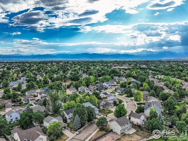aerial perspective of suburban area featuring a mountainous background